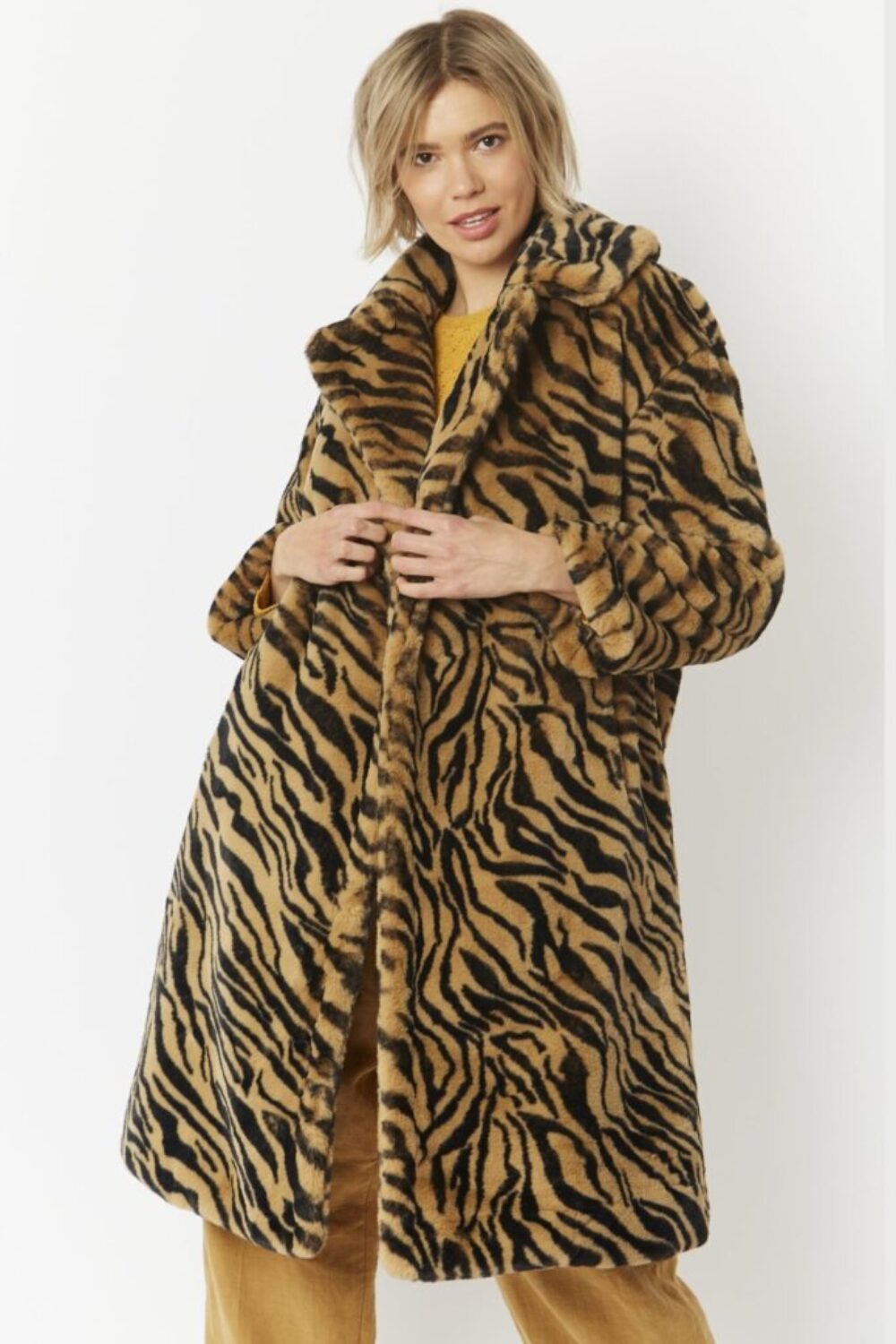 Shop Lux Animal Print Faux Fur Midi Shaved Shearling Coat and women's luxury and designer clothes at www.lux-apparel.co.uk