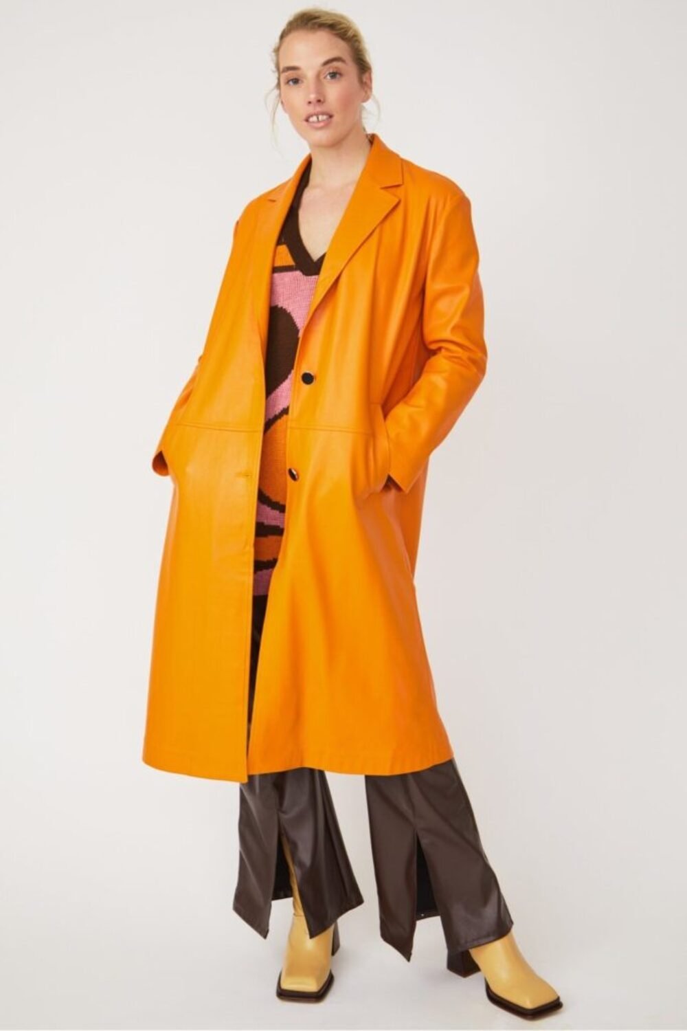 Shop Lux Orange Eco Leather Trench Coat and women's luxury and designer clothes at www.lux-apparel.co.uk