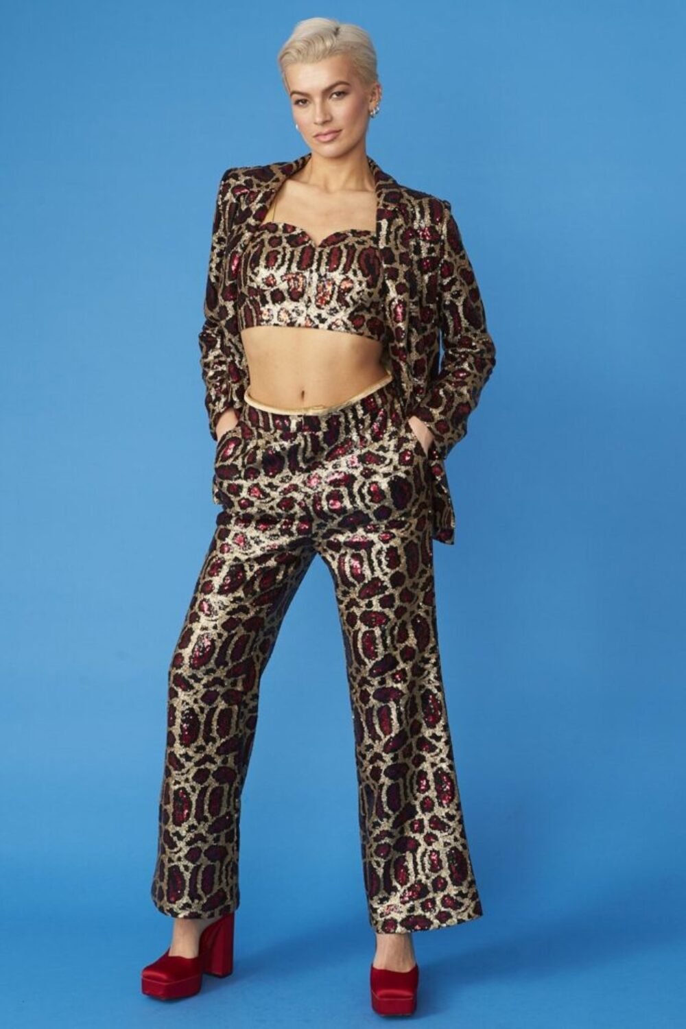 Shop Pink Animal Print Sequin Trousers and women's luxury and designer clothes at www.lux-apparel.co.uk